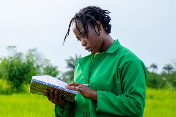 African woman reading a diary